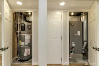 New hot water tank in one closet, storage in the other and forced air furnace is in the third. There is a heat pump for heating and air conditioning.