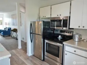 Kitchen w/ Stainless Steel appliances.