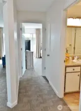 Hallway w/ the Main Bath to the left and the door straight-ahead leads into the Main Bedroom.
