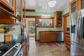 Kitchen overlooks the garden/sunroom.