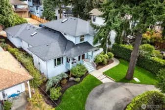 This Broadview home features a circular drive and garage off alley.
