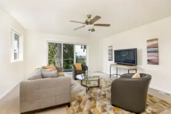 Upper level third bedroom or family room features balcony.