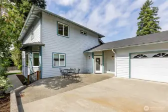 Large driveway and patio off alley.