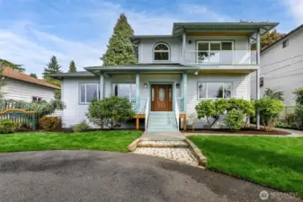 This Broadview home features a circular drive and garage off alley.