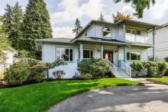 This Broadview home features a circular drive and garage off alley.
