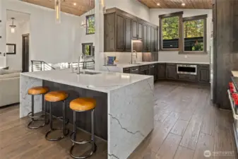 Chef’s kitchen with expansive island and custom cabinetry.