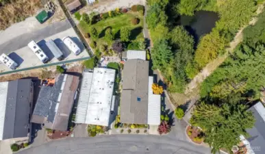 Composition Roof, covered back porch & extra community maintained yard behind unit #11