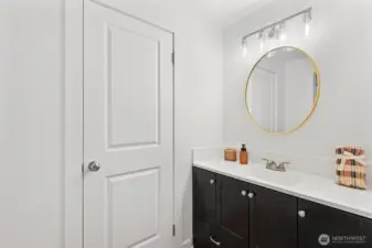 primary ensuite full bathroom with new mirror, lighting sconce, new vanity and sink hardware