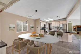 Formal dining area off the "modern-updated kitchen. Built in border hutches for storage of all dinnerware etc.  Virtually staged.