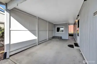 Enclosed, covered carport area. Access door into the utility room so no weather issues when unloading groceries etc.