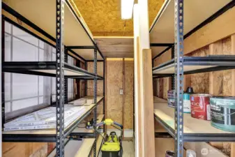 Shed at end of carport has power and built in shelving. Center space for yard tools etc.