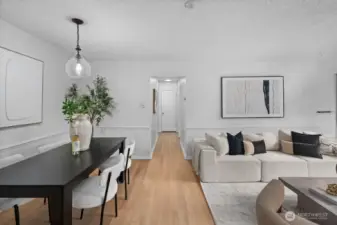 The spacious dining area easily accommodates a table of any size, ideal for everyday meals and entertaining alike.