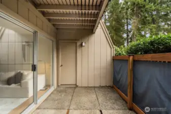 The covered, private patio is a true highlight, featuring attached storage and convenient access to community amenities including laundry facilities, pool, and clubhouse.