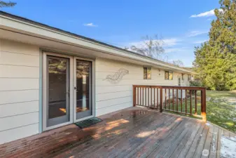 Quality french door leads to shady deck in the summertime