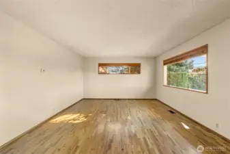 Bright sunny windows in generous living room.