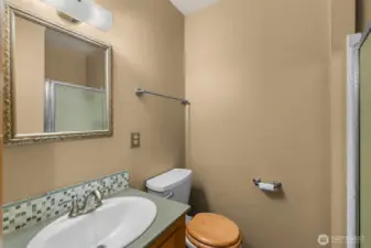 3/4 bath with quartz countertop, custom tile splash