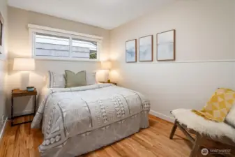 Middle of the three bedrooms; window facing north and higher up to offer some privacy.