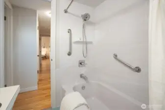 Bathroom is just off the hallway from the three bedrooms.