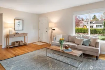 We'll come back to the main living space from the three bedrooms. Windows look out to the front yard (facing east).