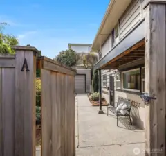 The detached garage is visible at the far end of this photo, and the entrance to the basement apartment is visible on the right-hand side (it's also accessible from the main floor via the staircase)