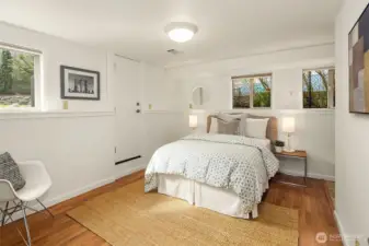 Another view of the downstairs bedroom, with its own external entrance to the backyard patio and light on two sides.