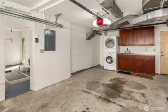 The attached garage, with the bonus room visible to the left. The entrance to the garage is at the bottom of the stairs, across the landing from the access door to the lower bedroom.