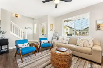 Door off living room leads to covered back deck and low maintenance backyard