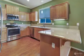 Fantastic kitchen with great color scheme, ample cabinets, granite counters, and stainless steel appliances.