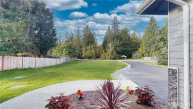 Home sits off of the road and the driveway is asphalt.