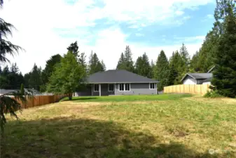 Huge back yard with room for shop and garden.