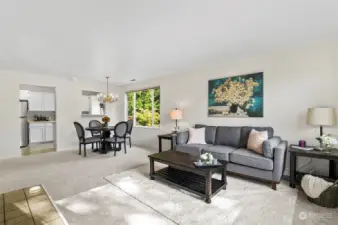 Spacious Living Area. Second floor Corner Unit allows for natural light to flow through the Windows.