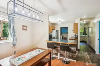 Dining area & bkfst bar for casual eating.