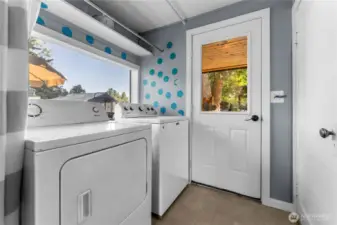 Laundry-mudroom transitions from the covered entry into the kitchen