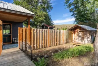 Open to light & garden views behind privacy fence