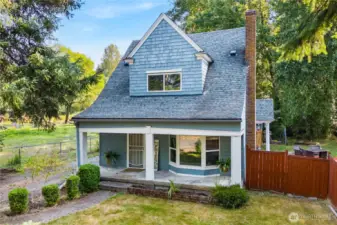 Charming 1915 cottage surrounded by mature trees, offering privacy and character. The large lot provides ample outdoor space, with a fully fenced yard and plenty of room to enjoy.