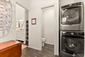 Laundry in Primary ensuite bath is convenient. Slate floor. Utility room. Folding table and more.