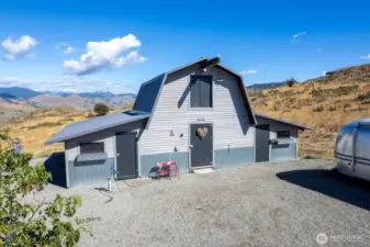 1000 sf Shop and Barn area offers separate studio. Workshop, Loft storage. Gear and vehicle storage.