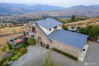 Home has Metal roof. Cedar Shake siding. Wood decks. Gardens and more. Live here. Laugh here. Love here.