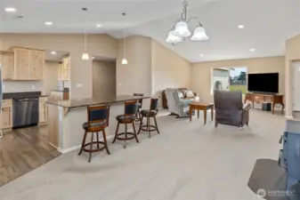 Vaulted great room with living space open to the kitchen.