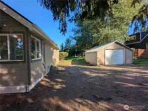 Detached garage with plenty of parking and easy access to the backyard