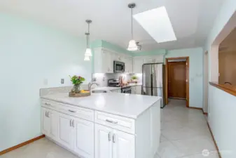 Love a skylight in the kitchen! Tons of cabinets!