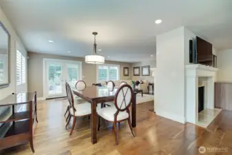 Spacious dining area open to both family and living room. Rarely seen walnut flooring throughout most of main living areas.