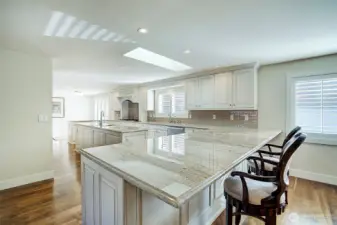 Custom cabinetry in this newly remodeled chef's kitchen! Enjoy the center island with prep sink, unbelievable counter space & granite counters.