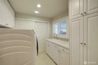 Laundry room with built ins and work sink.