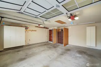 large double car garage with built in storage including wine cellar and cedar lined closet for keeping your special garments protected.