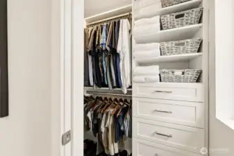 Walk-in closet with custom organization for effortless storage.