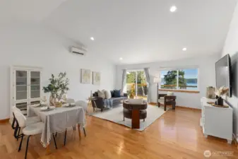 This light-filled residence showcases a dramatic Great room with vaulted ceilings,