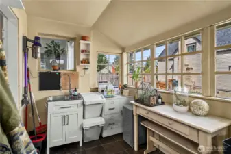 Back enclosed porch for pantry space or a great place to grow herbs just off the kitchen
