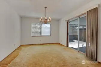 This room was added on and was used as a dining area, slider leads out to covered patio. This are does not have hardwood.