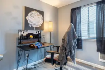 Number 1 of the two smaller bedrooms. Large closet is present to hold a multitude of stuff.